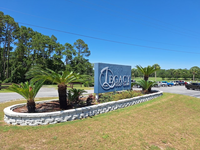 108 Colony Bay Harbour Dr, Panama City Beach, FL 32407 - community sign with a yard and uncovered parking