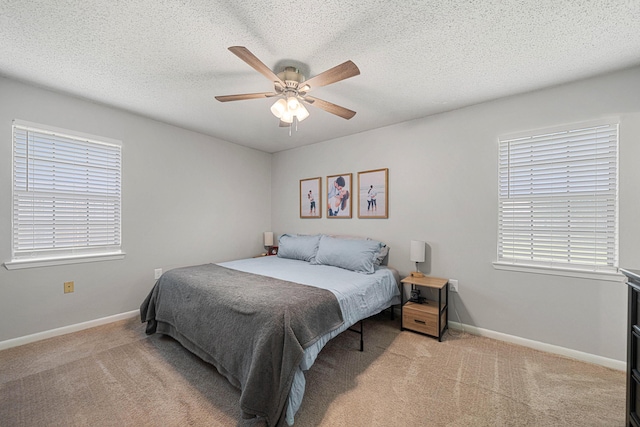617 Schneider Dr, Fort Walton Beach, FL 32547 - carpeted bedroom featuring a ceiling fan, baseboards, and a textured ceiling
