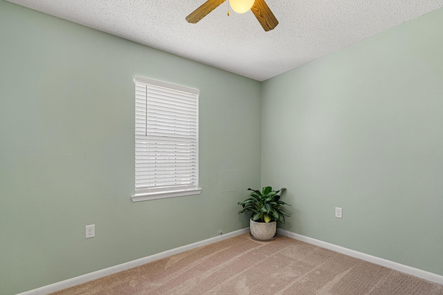 617 Schneider Dr, Fort Walton Beach, FL 32547 - carpeted spare room featuring a ceiling fan, baseboards, and a textured ceiling