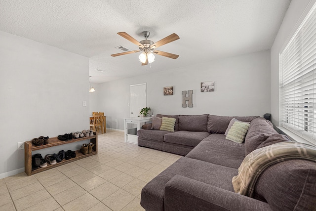 617 Schneider Dr, Fort Walton Beach, FL 32547 - living area featuring a ceiling fan, a textured ceiling, and light tile patterned flooring