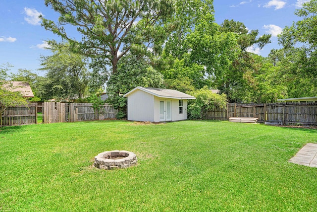 617 Schneider Dr, Fort Walton Beach, FL 32547 - view of yard featuring a fire pit and an outdoor structure