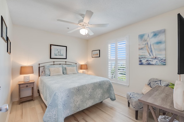 8436 Gulf Blvd Unit 734, Navarre, FL 32566 - bedroom featuring light wood-style floors, baseboards, and a ceiling fan