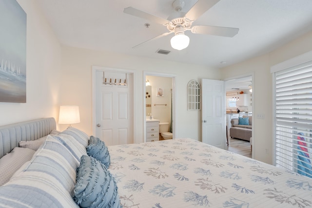 8436 Gulf Blvd Unit 734, Navarre, FL 32566 - bedroom with ensuite bath and a ceiling fan