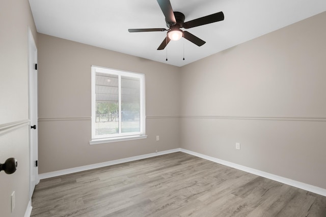 3437 Auburn Rd, Crestview, FL 32539 - unfurnished room with wood finished floors, ceiling fan, and baseboards
