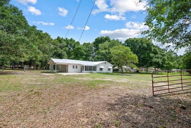 3437 Auburn Rd, Crestview, FL 32539 - rear view of property with a patio and view of scattered trees