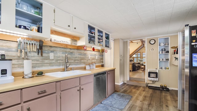 2765 Shade Tree Ln, Ponce De Leon, FL 32455 - kitchen with a sink, heating unit, stainless steel appliances, open shelves, and dark wood-type flooring