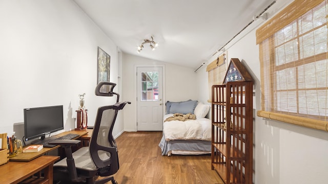 2765 Shade Tree Ln, Ponce De Leon, FL 32455 - bedroom with lofted ceiling, wood finished floors, an office area, and baseboards