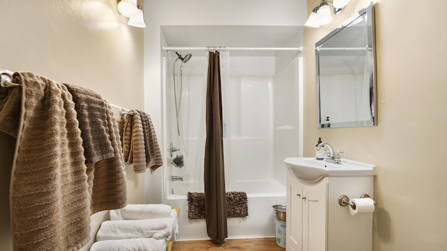 2765 Shade Tree Ln, Ponce De Leon, FL 32455 - bathroom featuring vanity, shower / bath combo with shower curtain, and wood finished floors