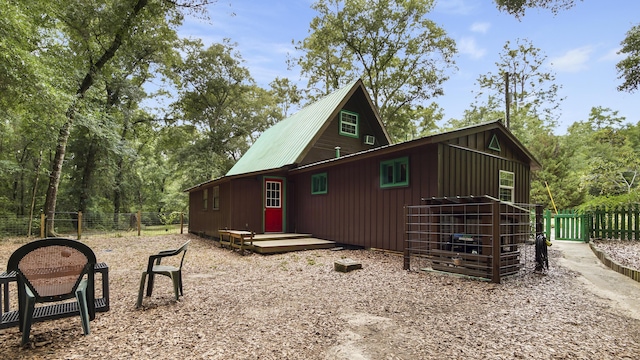 2765 Shade Tree Ln, Ponce De Leon, FL 32455 - view of property exterior with board and batten siding and metal roof