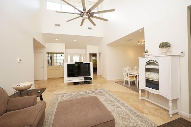 115 Gleneagles Dr, Niceville, FL 32578 - living area with ceiling fan, healthy amount of natural light, a towering ceiling, and baseboards