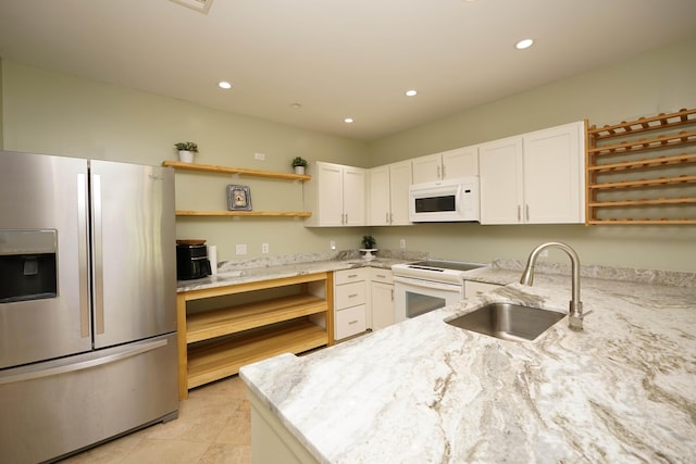 115 Gleneagles Dr, Niceville, FL 32578 - kitchen featuring white appliances, open shelves, a sink, light stone counters, and recessed lighting