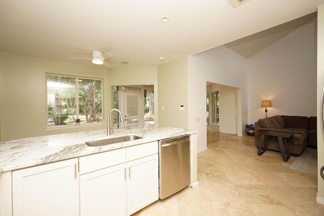 115 Gleneagles Dr, Niceville, FL 32578 - kitchen with stainless steel dishwasher, a sink, light stone countertops, and white cabinetry