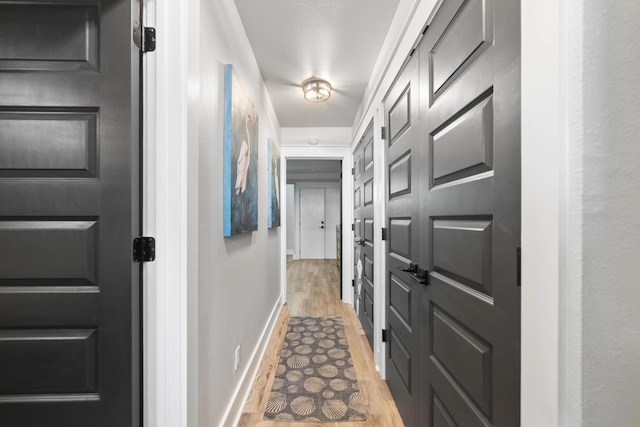 415 Gulf Shore Dr Unit 23, Destin, FL 32541 - corridor featuring light wood-type flooring and baseboards