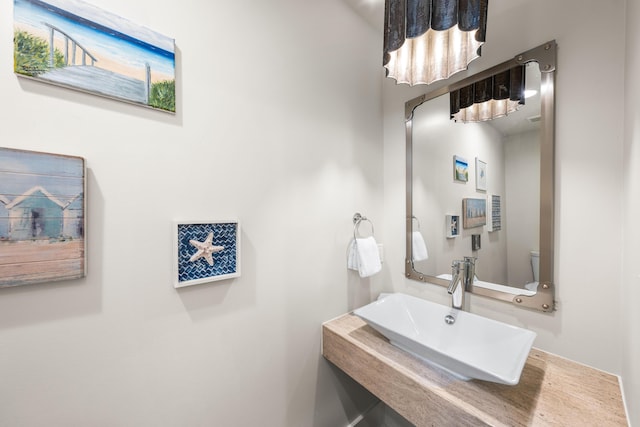 21 Founders Ct, Watersound, FL 32461 - half bathroom with a sink and toilet