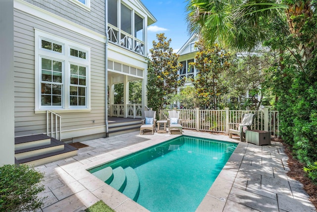 21 Founders Ct, Watersound, FL 32461 - view of swimming pool featuring a patio area and a deck