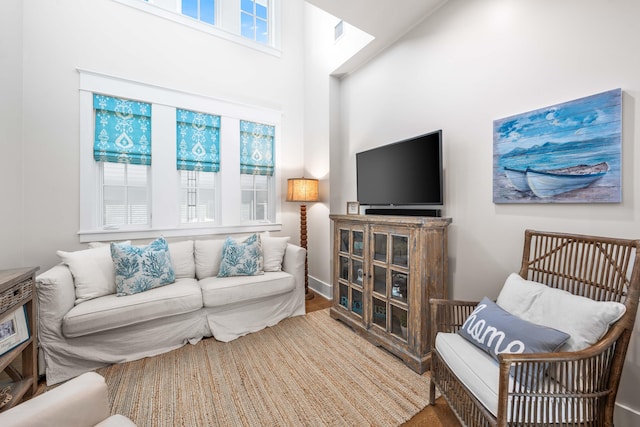 21 Founders Ct, Watersound, FL 32461 - living room with a high ceiling and wood finished floors