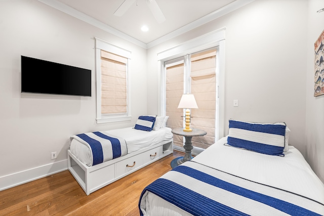 21 Founders Ct, Watersound, FL 32461 - bedroom with wood finished floors, crown molding, and a ceiling fan