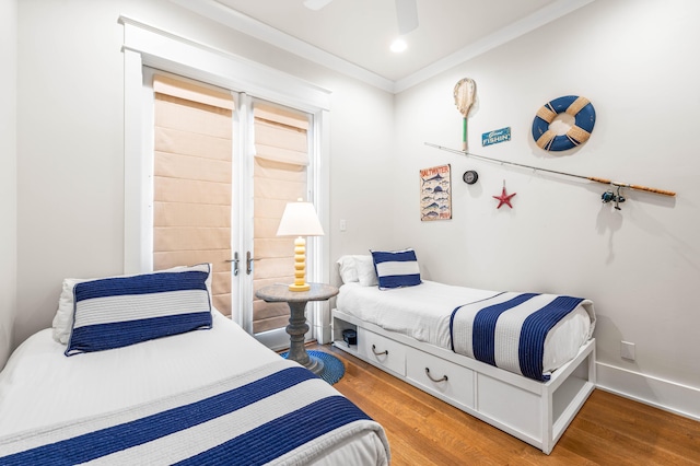 21 Founders Ct, Watersound, FL 32461 - bedroom featuring wood finished floors, ornamental molding, a ceiling fan, recessed lighting, and french doors