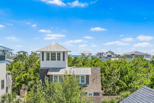 21 Founders Ct, Watersound, FL 32461 - view of side of property with a metal roof and a standing seam roof
