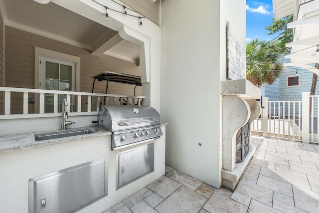 21 Founders Ct, Watersound, FL 32461 - view of patio featuring a sink and an outdoor kitchen