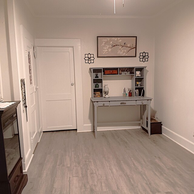 72 Park Ave, Defuniak Springs, FL 32435 - hall featuring crown molding, wood finished floors, and baseboards