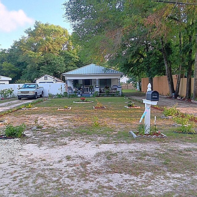 72 Park Ave, Defuniak Springs, FL 32435 - view of yard with a porch