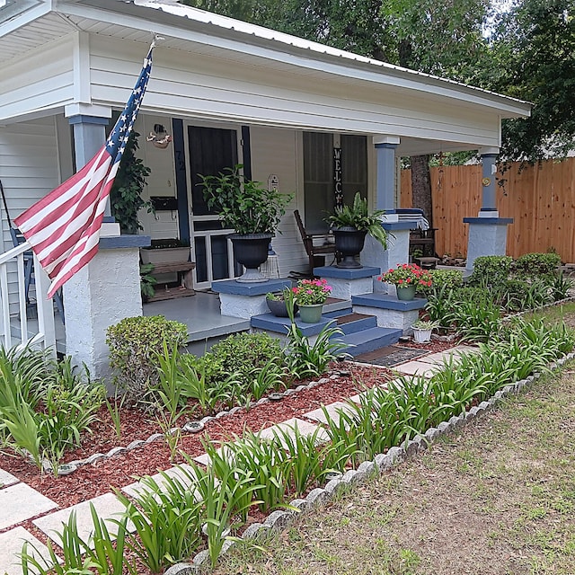 72 Park Ave, Defuniak Springs, FL 32435 - doorway to property featuring covered porch
