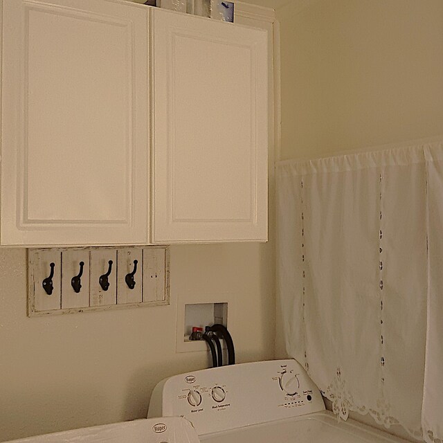 72 Park Ave, Defuniak Springs, FL 32435 - washroom featuring cabinet space and washer / dryer