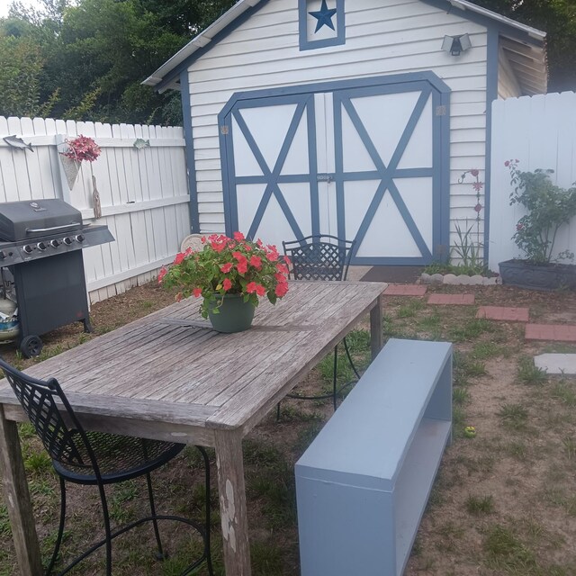 72 Park Ave, Defuniak Springs, FL 32435 - view of shed with outdoor dining space