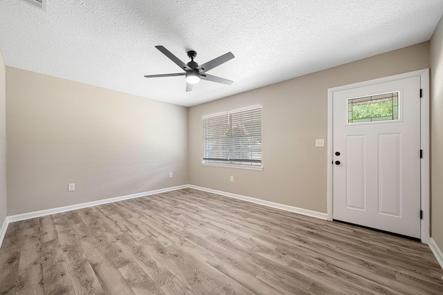 207 Oglesby Ave, Crestview, FL 32536 - foyer with wood finished floors, ceiling fan, and a textured ceiling