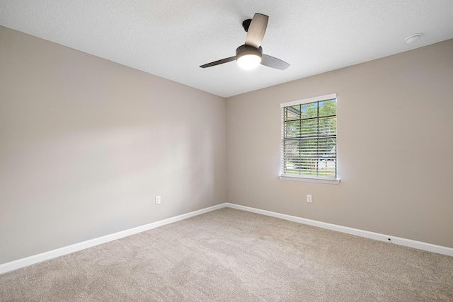 207 Oglesby Ave, Crestview, FL 32536 - unfurnished room featuring carpet flooring, a ceiling fan, a smoke detector, and a textured ceiling