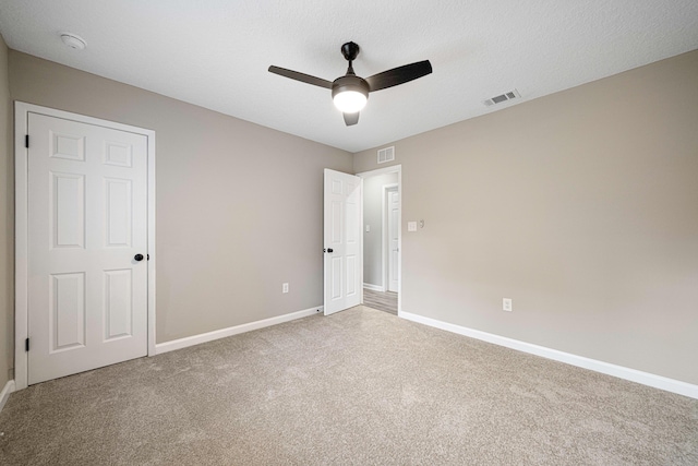 207 Oglesby Ave, Crestview, FL 32536 - unfurnished bedroom with carpet floors and a ceiling fan