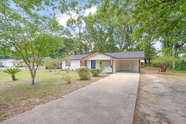 207 Oglesby Ave, Crestview, FL 32536 - ranch-style home with driveway and a carport