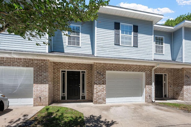 996 Leigh Ann Ln, Fort Walton Beach, FL 32547 - view of front facade featuring driveway, a garage, and brick siding
