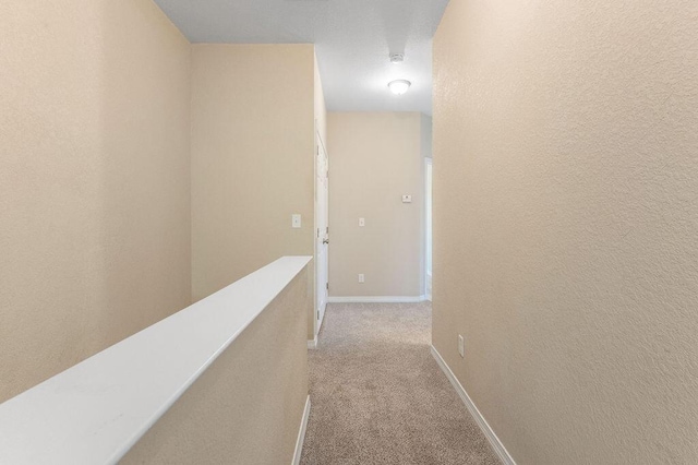 996 Leigh Ann Ln, Fort Walton Beach, FL 32547 - hall featuring carpet flooring, an upstairs landing, and baseboards