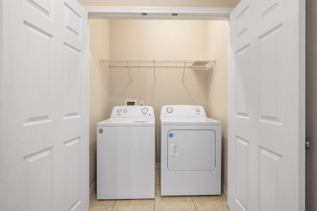 996 Leigh Ann Ln, Fort Walton Beach, FL 32547 - laundry room featuring separate washer and dryer and light tile patterned floors
