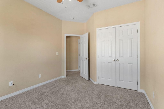 996 Leigh Ann Ln, Fort Walton Beach, FL 32547 - unfurnished bedroom with light carpet, baseboards, a closet, and ceiling fan