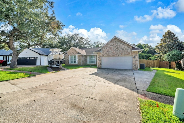 283 Stahlman Ave, Destin, FL 32541 - single story home featuring concrete driveway, brick siding, and a garage