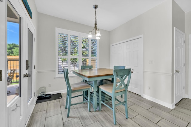 283 Stahlman Ave, Destin, FL 32541 - dining space with wood finish floors, baseboards, and healthy amount of natural light