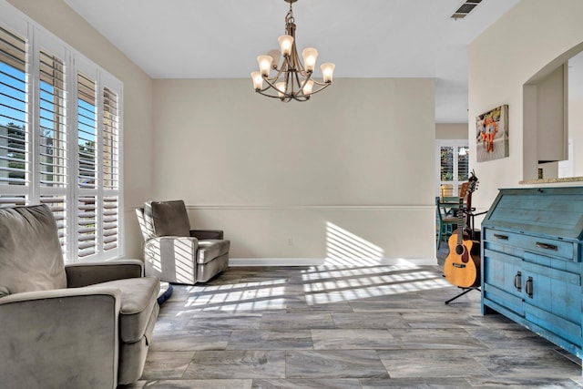 283 Stahlman Ave, Destin, FL 32541 - living area featuring a chandelier, arched walkways, wood finished floors, and baseboards