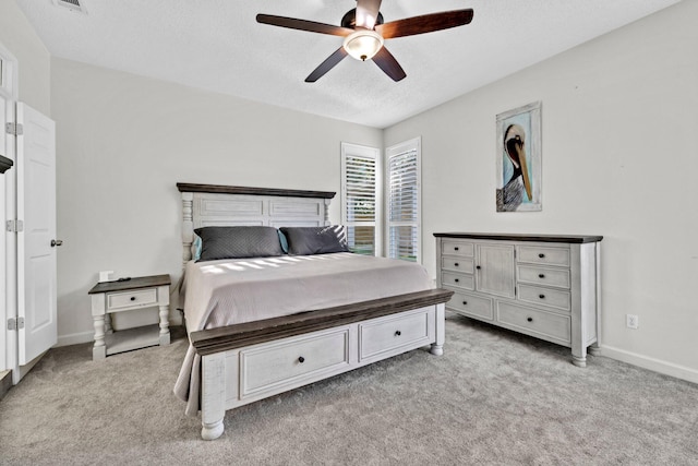 283 Stahlman Ave, Destin, FL 32541 - carpeted bedroom with a textured ceiling, baseboards, and ceiling fan