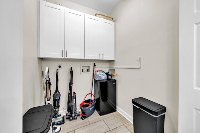 283 Stahlman Ave, Destin, FL 32541 - laundry area with washer hookup, cabinet space, baseboards, and hookup for an electric dryer
