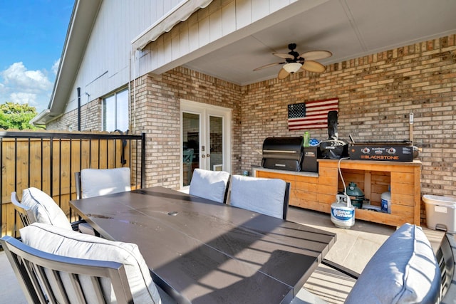 283 Stahlman Ave, Destin, FL 32541 - wooden terrace with ceiling fan, french doors, outdoor dining area, and a grill