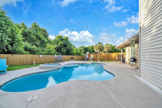 283 Stahlman Ave, Destin, FL 32541 - view of pool featuring a patio area, a fenced backyard, a pool with connected hot tub, and view of scattered trees