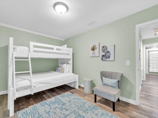 50 Gossamer Ln Unit 10, Inlet Beach, FL 32461 - bedroom featuring wood finished floors and baseboards