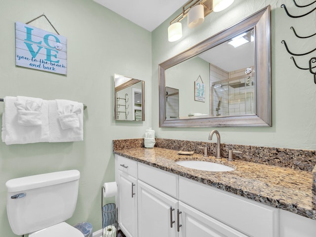 50 Gossamer Ln Unit 10, Inlet Beach, FL 32461 - bathroom featuring vanity, toilet, and a tile shower