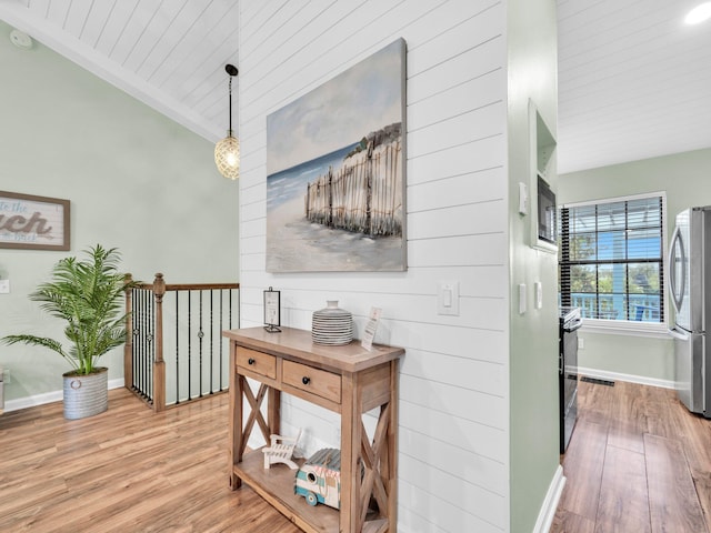 50 Gossamer Ln Unit 10, Inlet Beach, FL 32461 - hallway with wood finished floors, baseboards, wooden ceiling, and crown molding