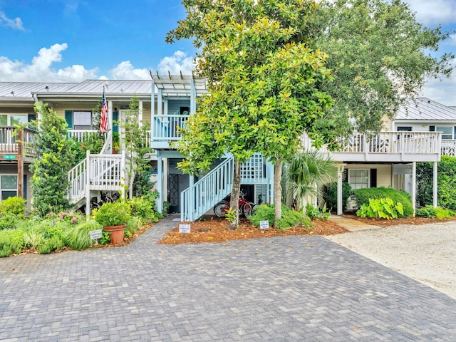 50 Gossamer Ln Unit 10, Inlet Beach, FL 32461 - view of front of home featuring stairway, a standing seam roof, metal roof, and a porch