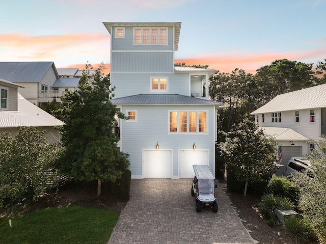 51 Grande Pointe Dr, Inlet Beach, FL 32461 - view of front facade featuring decorative driveway, metal roof, and an attached garage