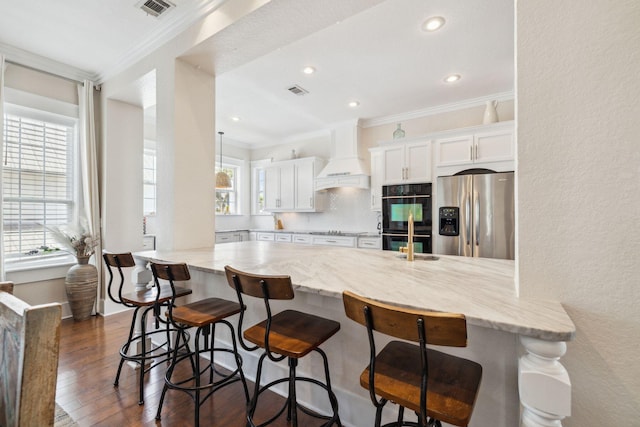 51 Grande Pointe Dr, Inlet Beach, FL 32461 - kitchen featuring black appliances, crown molding, premium range hood, light stone counters, and white cabinets